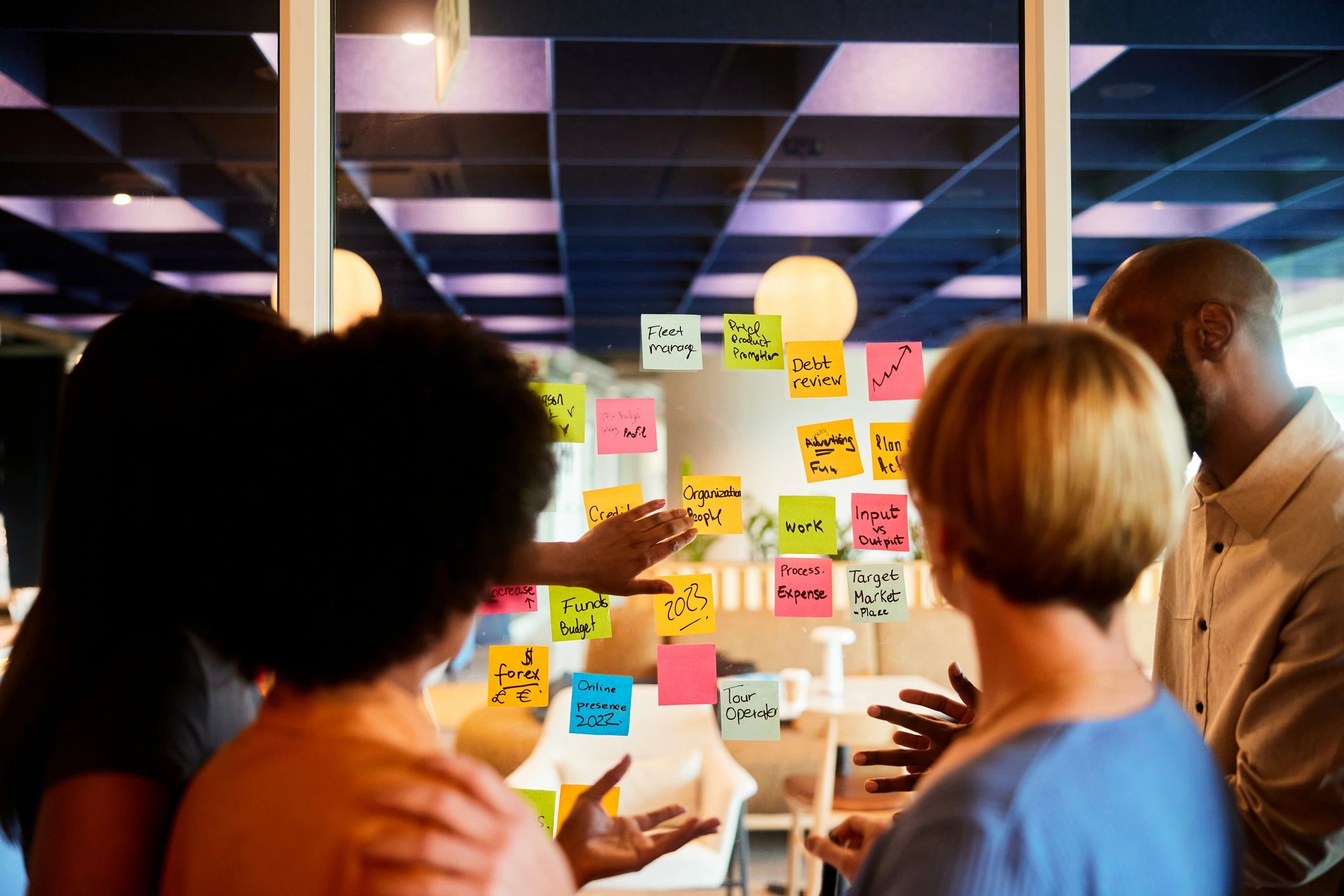 Team brainstorming with colorful sticky notes.