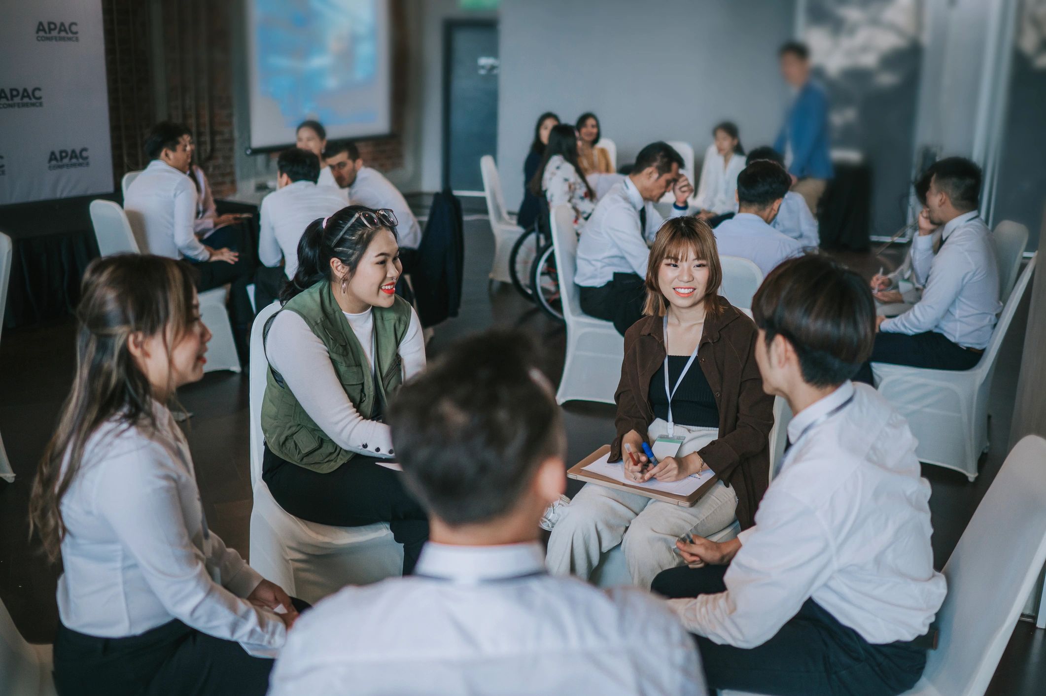 People in a group discussion at conference.