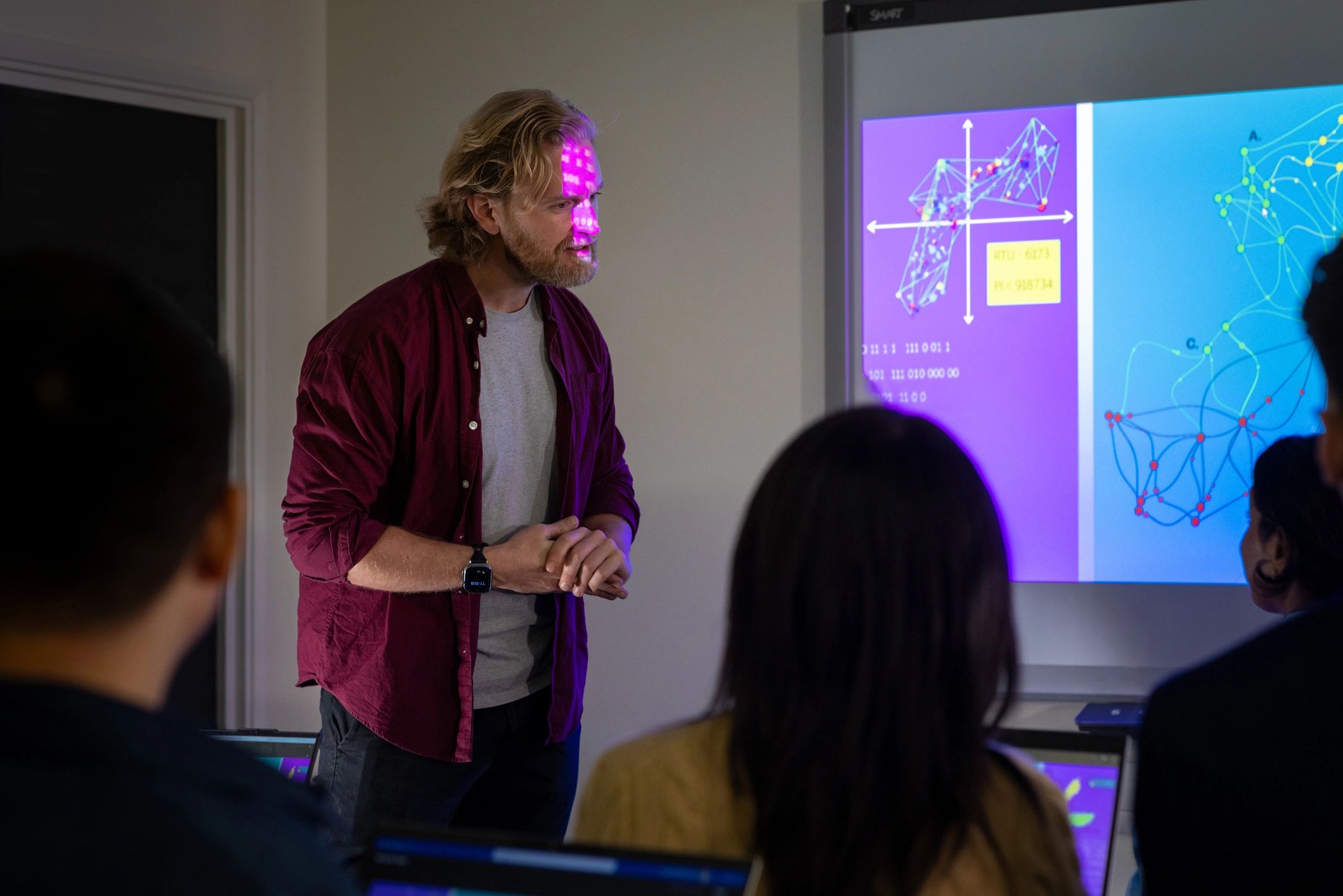 Person presenting data to an audience.