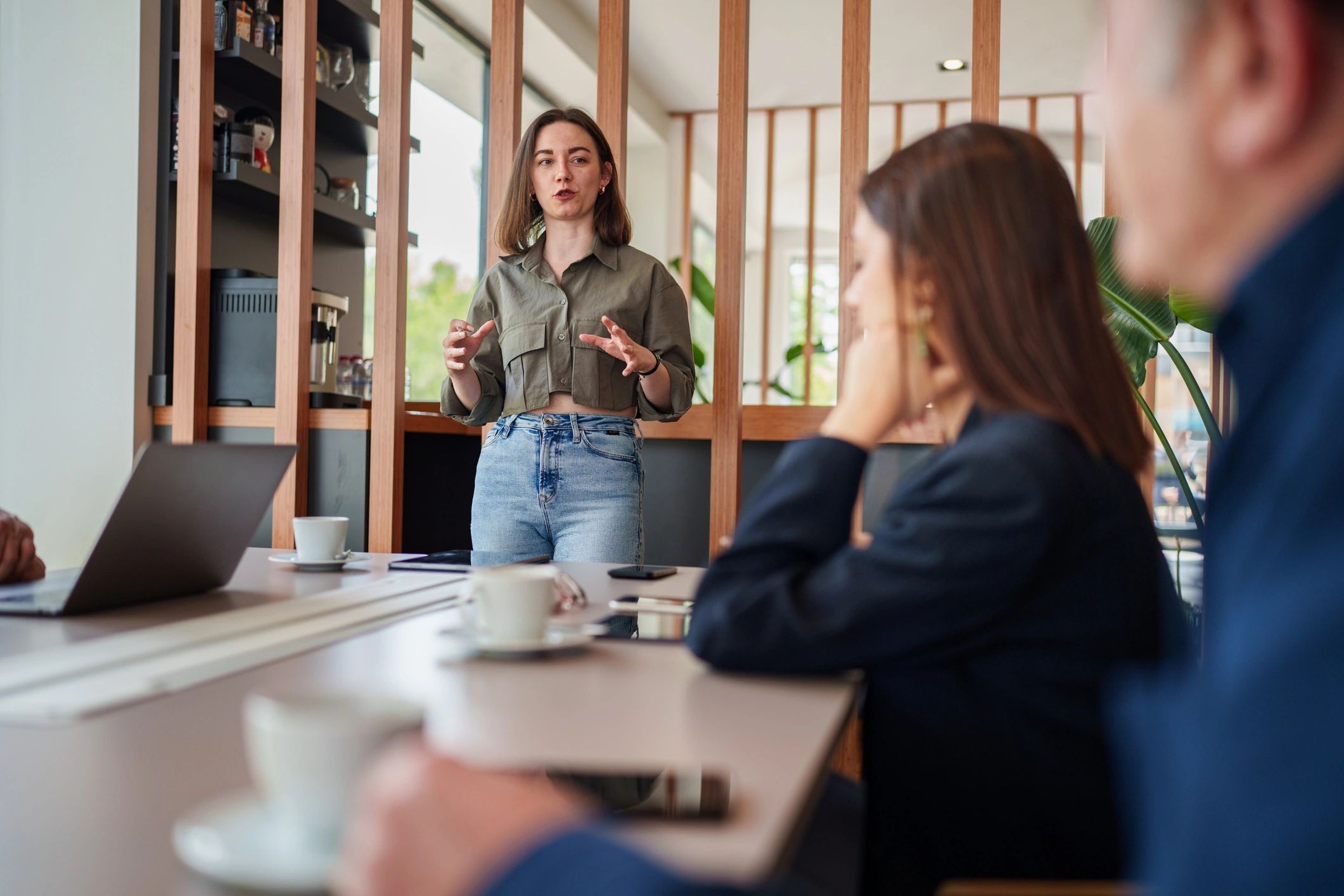 Woman presenting in a business meeting.